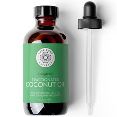 Pure Body Naturals fractionated coconut oil bottle with amber glass protects contents.