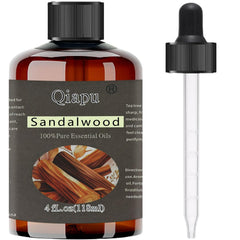 Bottle of pure natural sandalwood essential oil with dropper