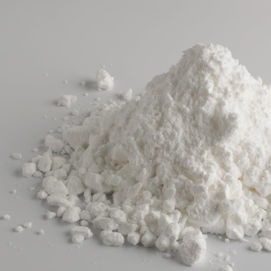 Packaging of Pure Original Magnesium Carbonate on a white surface