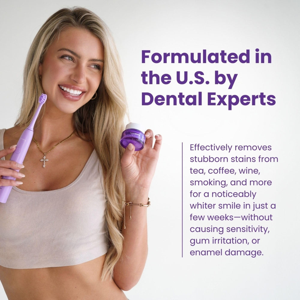Toothbrush dipped into toothpaste with Simply Purple powder for whitening