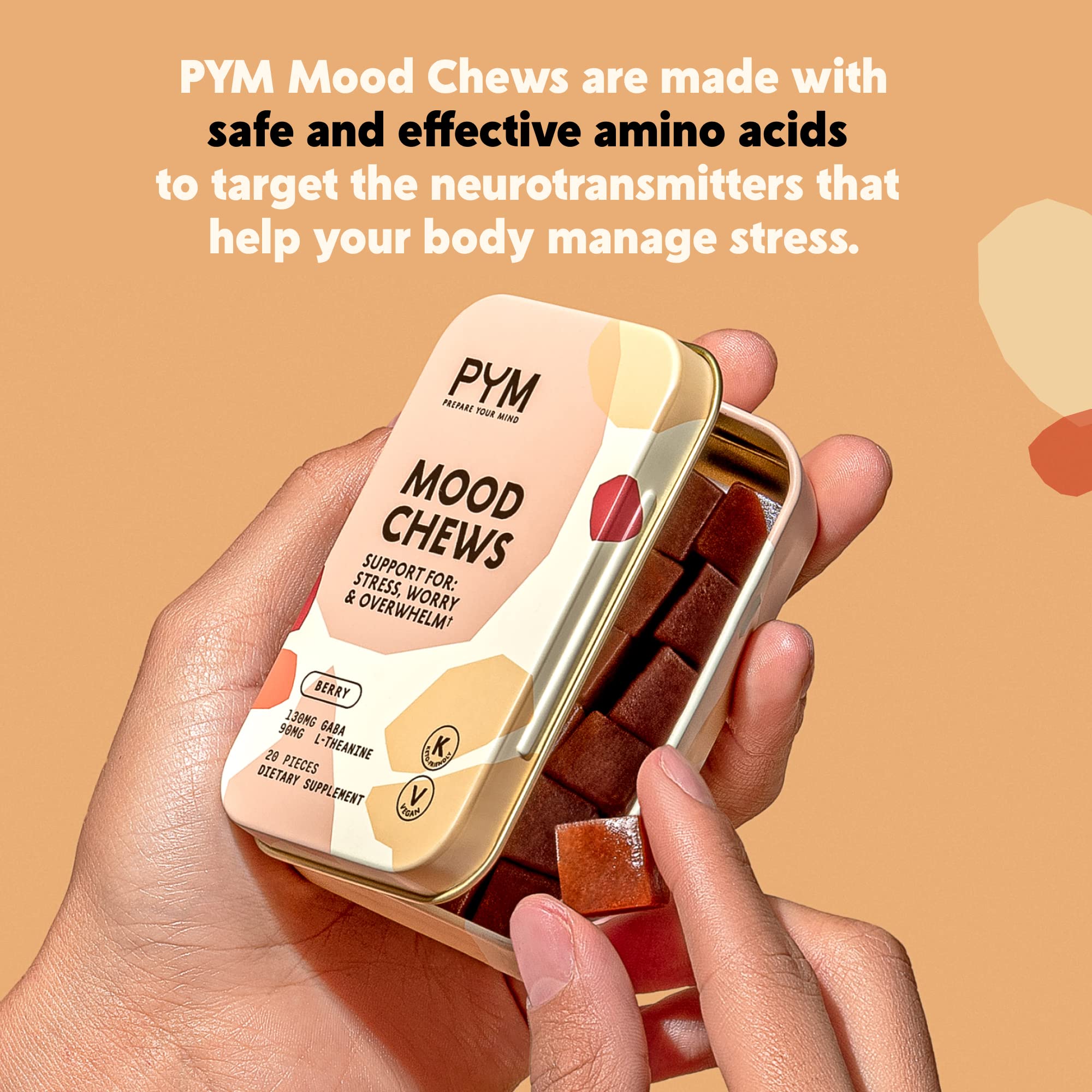 On-the-go PYM Berry Mood Chews next to a phone and notebook
