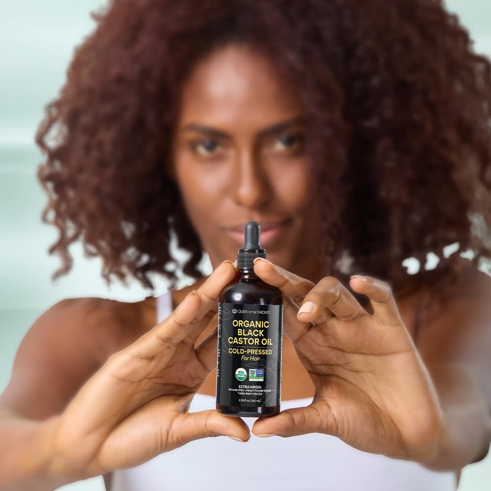 Castor oil being used on hair for conditioning