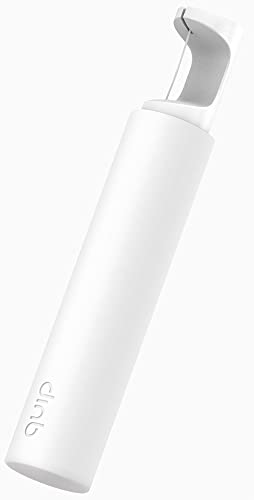 Mint floss refill spool expanding to clean between teeth – close-up