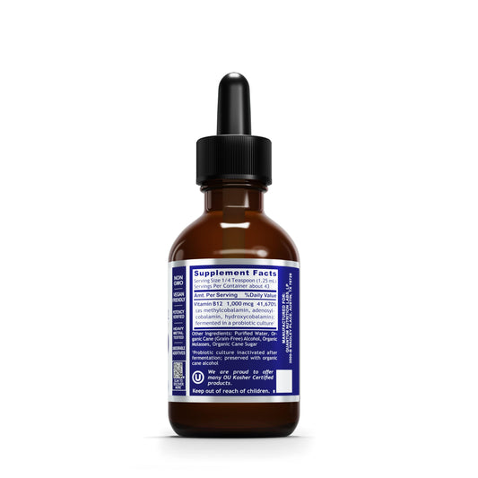 Close-up of liquid B12 drops from the dropper