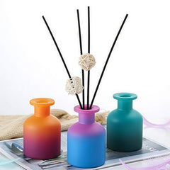 QUUPY blue-gradient diffuser bottle for calming aromatherapy in any room.