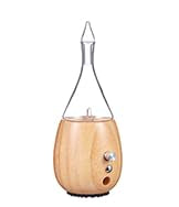 Close-up of Raindrop 2.0 glass nebulizer releasing essential oil mist
