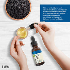 Pouring RAWYA Black Seed Oil from a glass bottle
