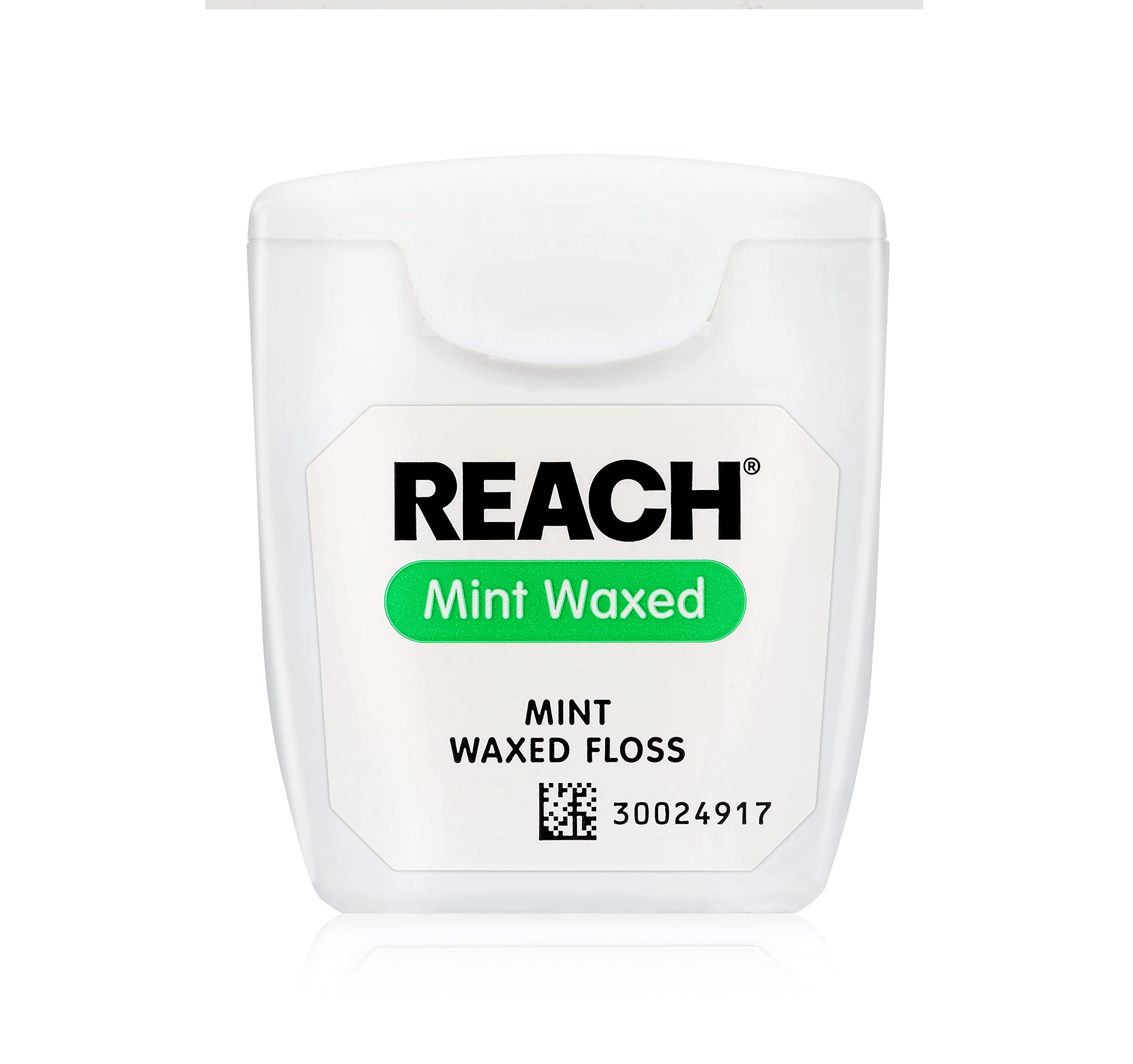 Floss being prepared for use with mint flavor