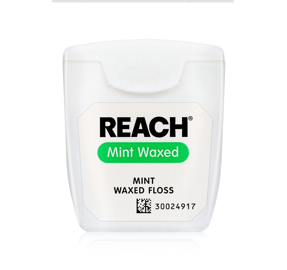 Floss being prepared for use with mint flavor