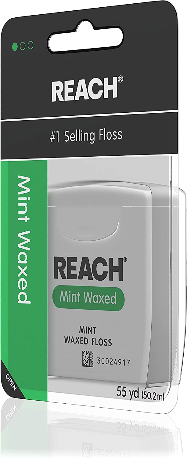 Mint-flavored waxed Reach dental floss texture close-up
