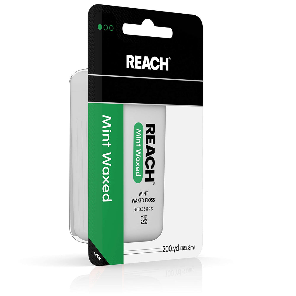 Mint flavored Reach floss removes plaque and debris