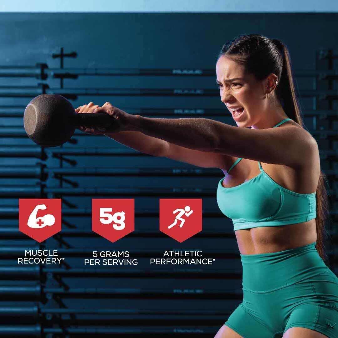 Scoop containing creatine monohydrate powder