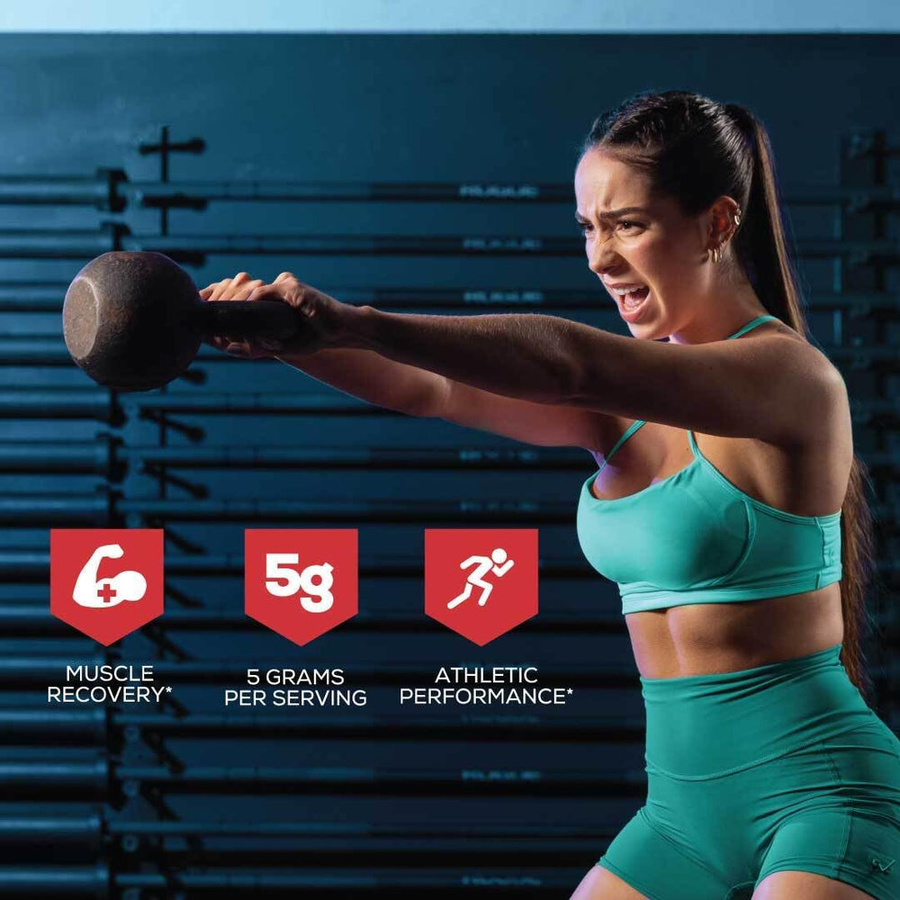 Scoop containing creatine monohydrate powder