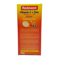 Effervescent tablet dissolving in water: Redoxon Orange Vitamin C with Zinc