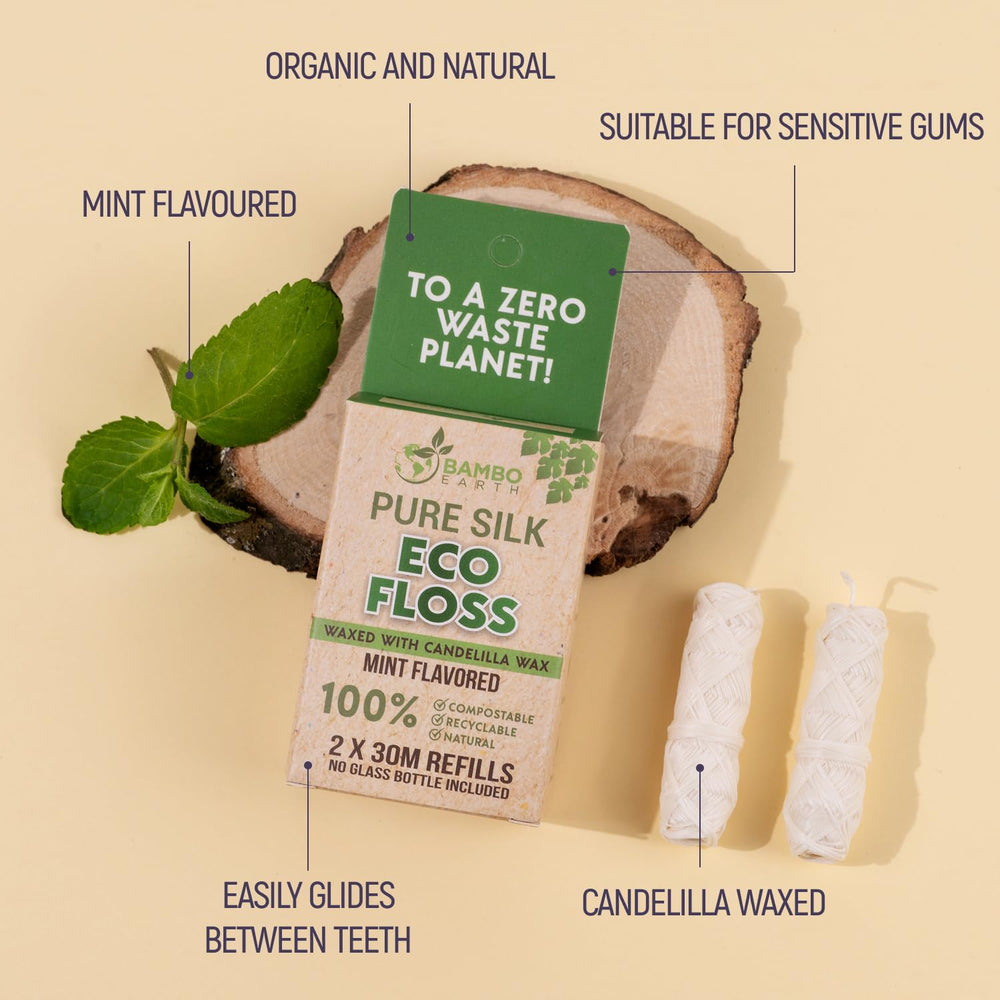 Two refillable flossers beside a glass jar