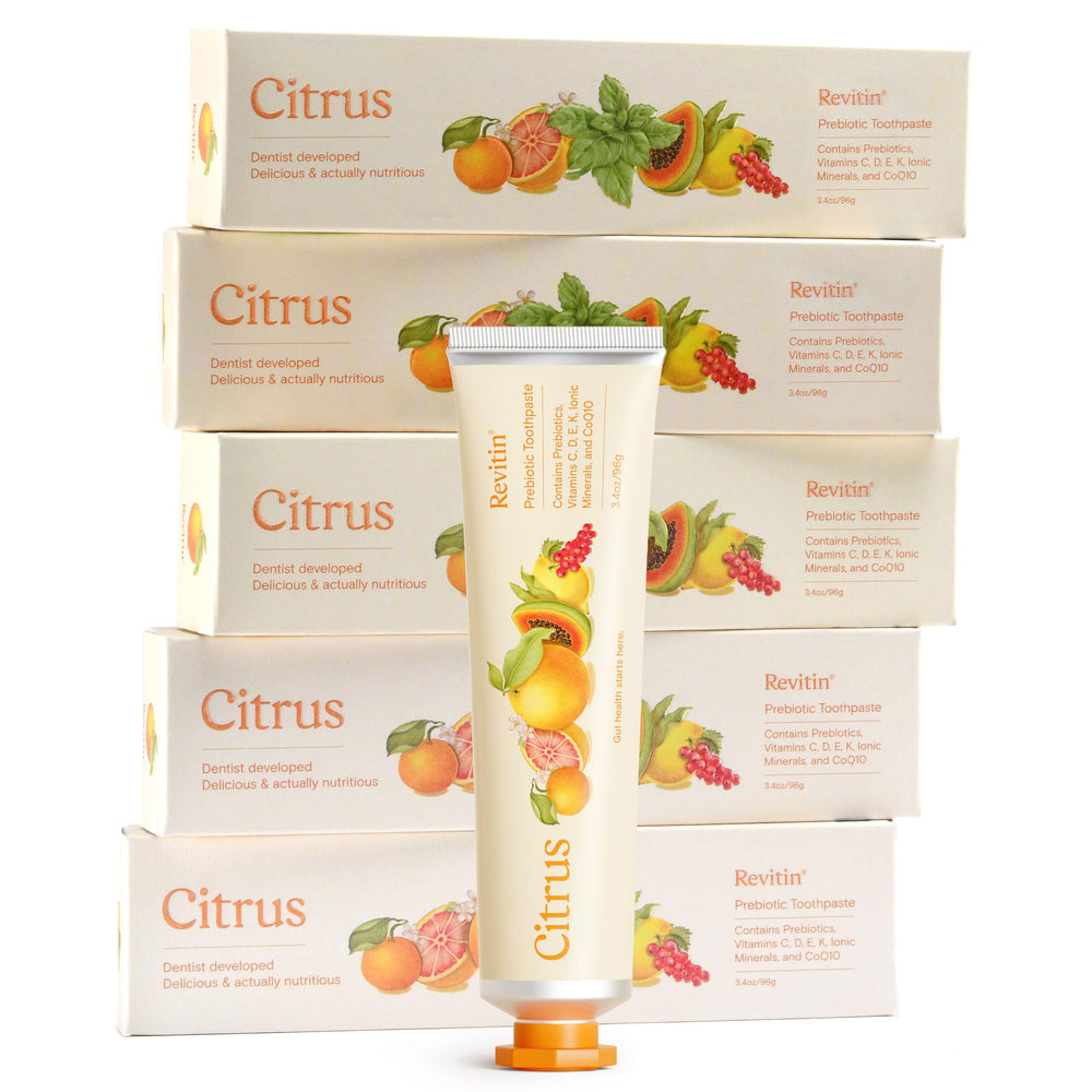 Revitin fluoride-free citrus toothpaste tube on white background
