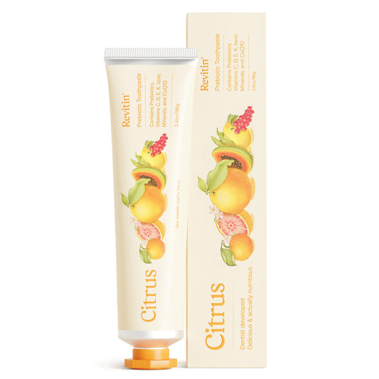 Revitin citrus toothpaste tube on a white background