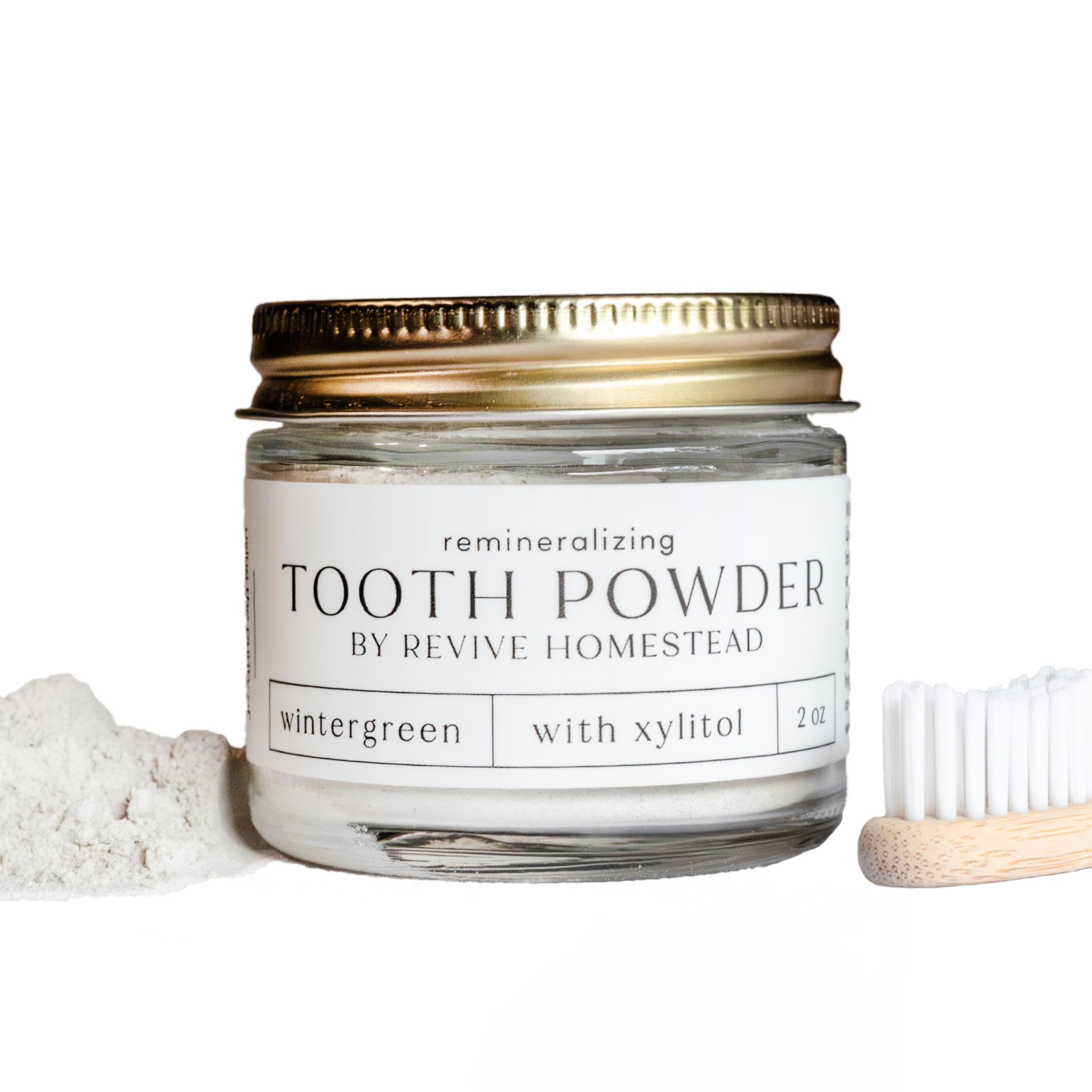 Revive Homestead Hydroxyapatite Tooth Powder in amber glass jar with erythritol