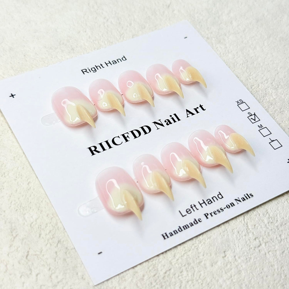 RIICFDD beige curved stiletto cat-claw nails on tray for durable wear.