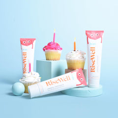 Close-up of RiseWell Kids toothpaste branding indicating dentist-made product