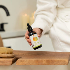 River Cosmetics Neem Oil applied to skin for moisture and softness.