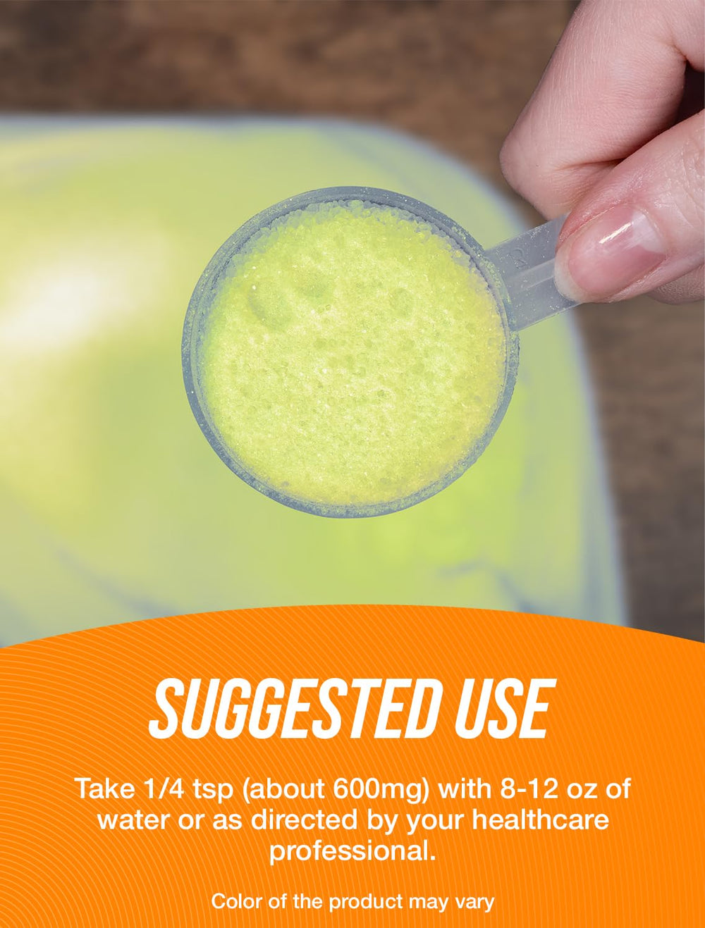 Measuring scoop adding R-ALA powder to a beverage