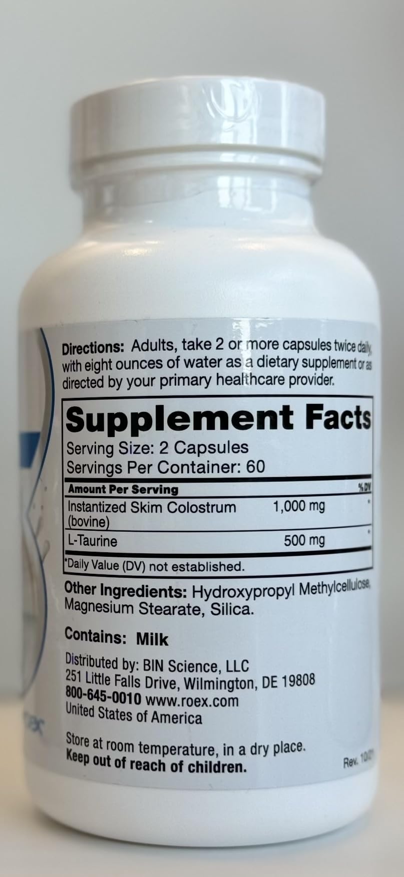 Capsules poured next to a measuring spoon
