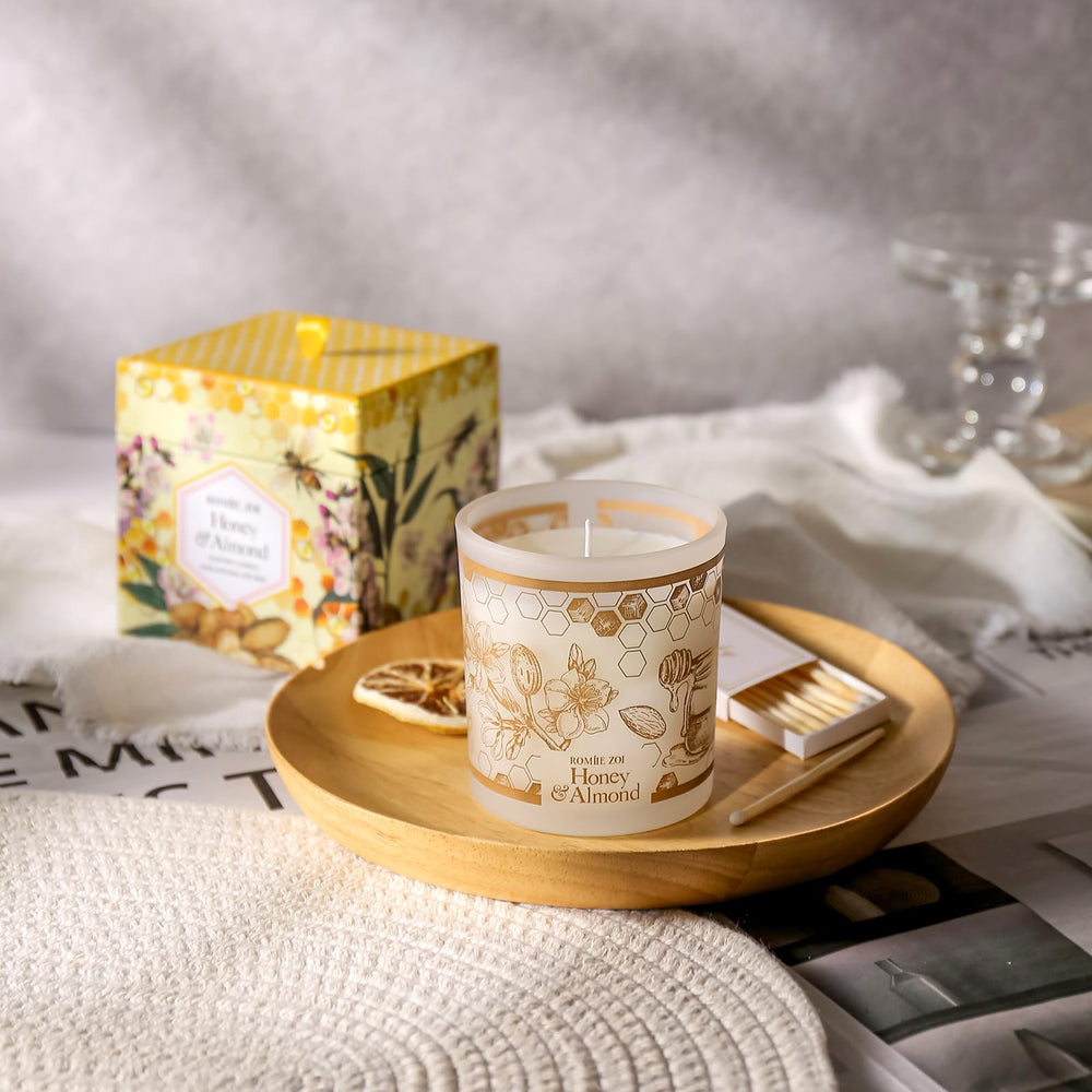 ROMIIE ZOI 6oz soy wax candle burning in a relaxing setting