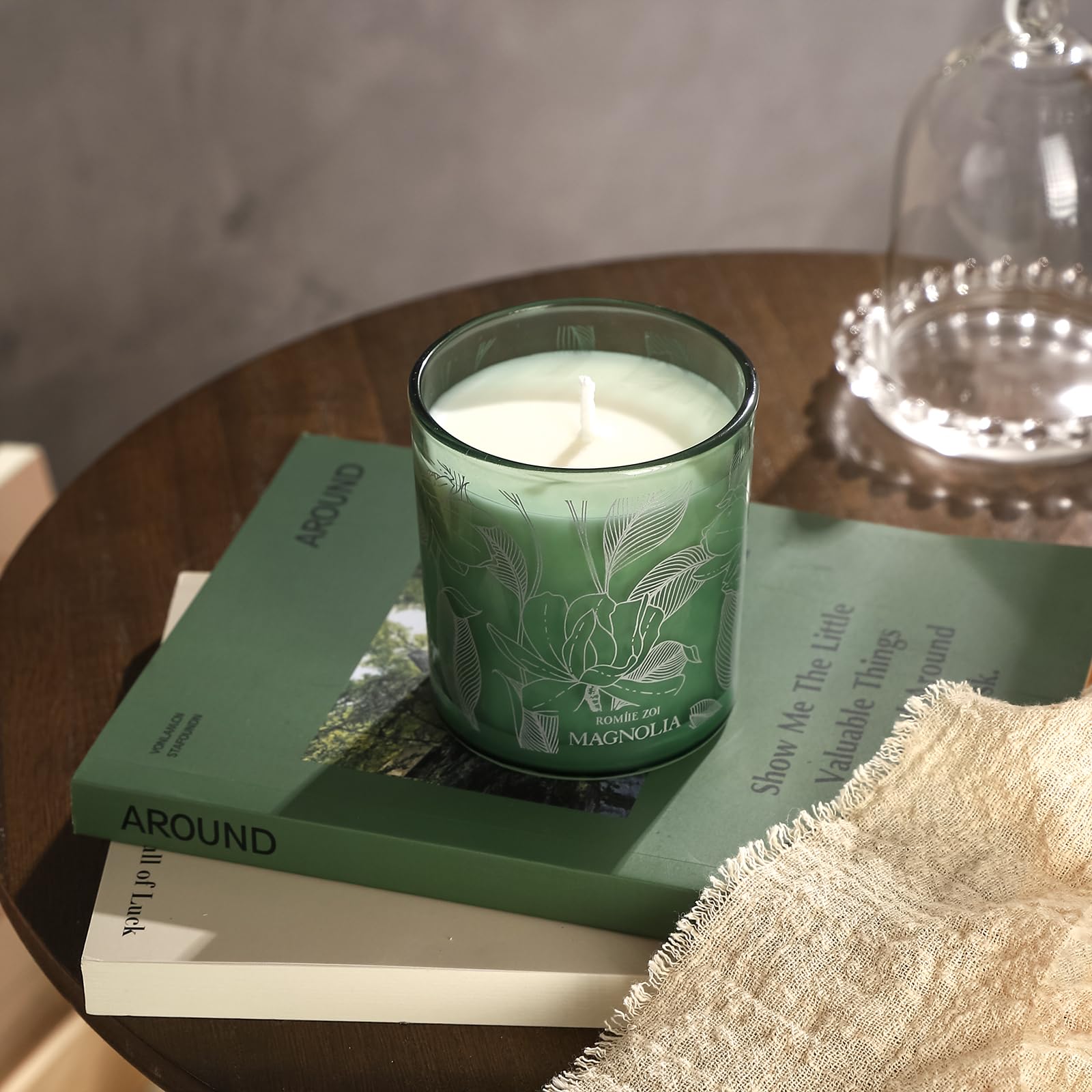 ROMIIE ZOI Magnolia candle in a cozy home/office setting