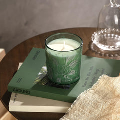 ROMIIE ZOI Magnolia candle in a cozy home/office setting