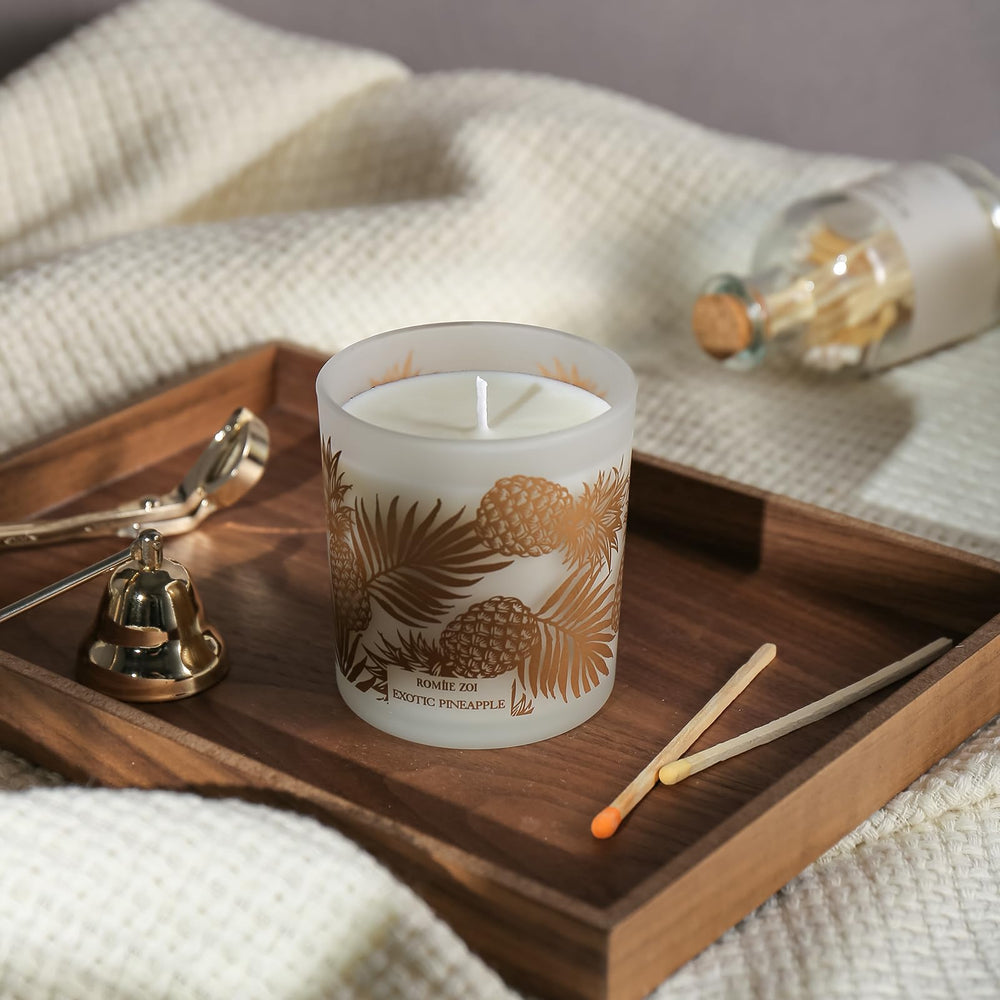 ROMIIE ZOI Pineapple candle lit, showing a clean burn
