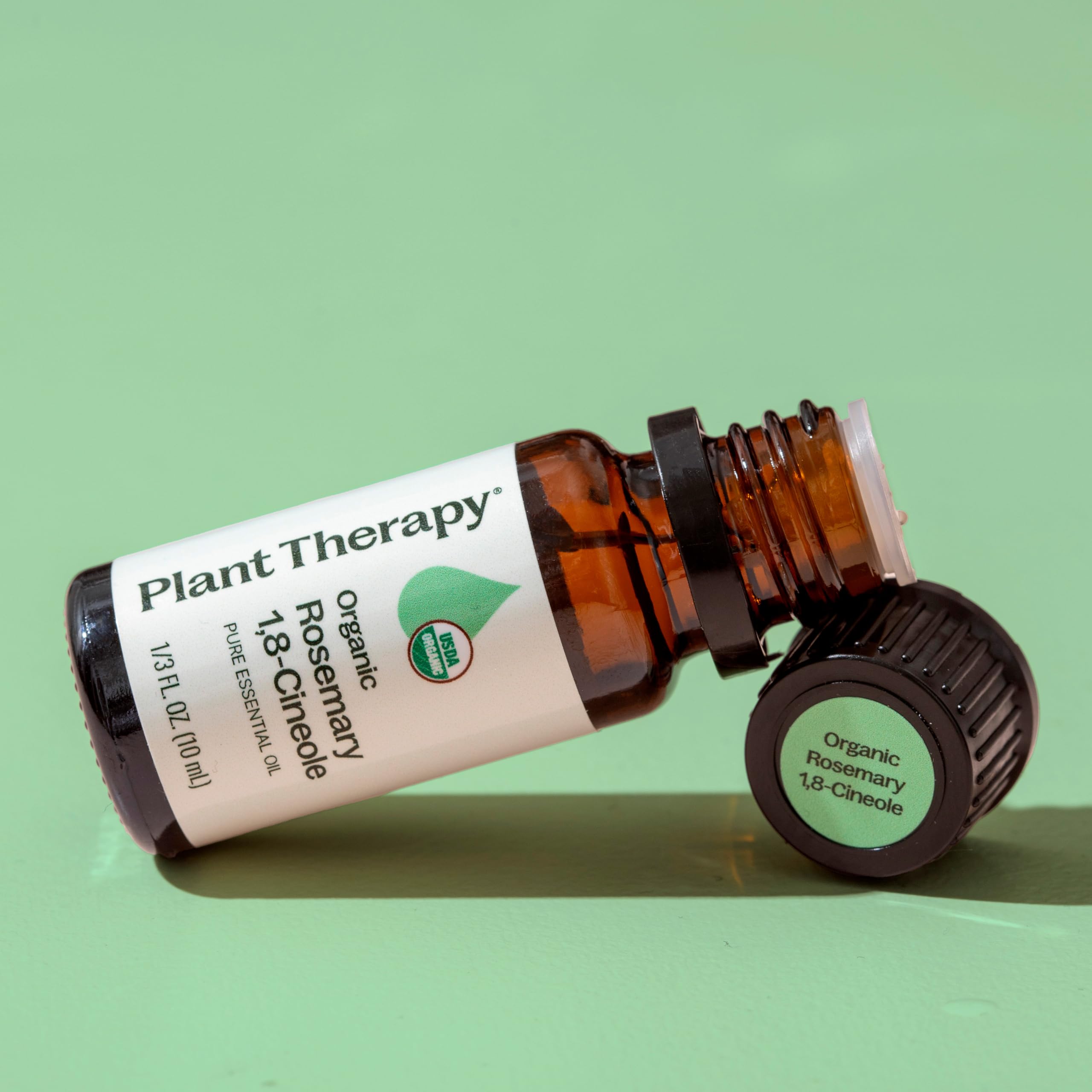 Applying rosemary essential oil to scalp (diluted)