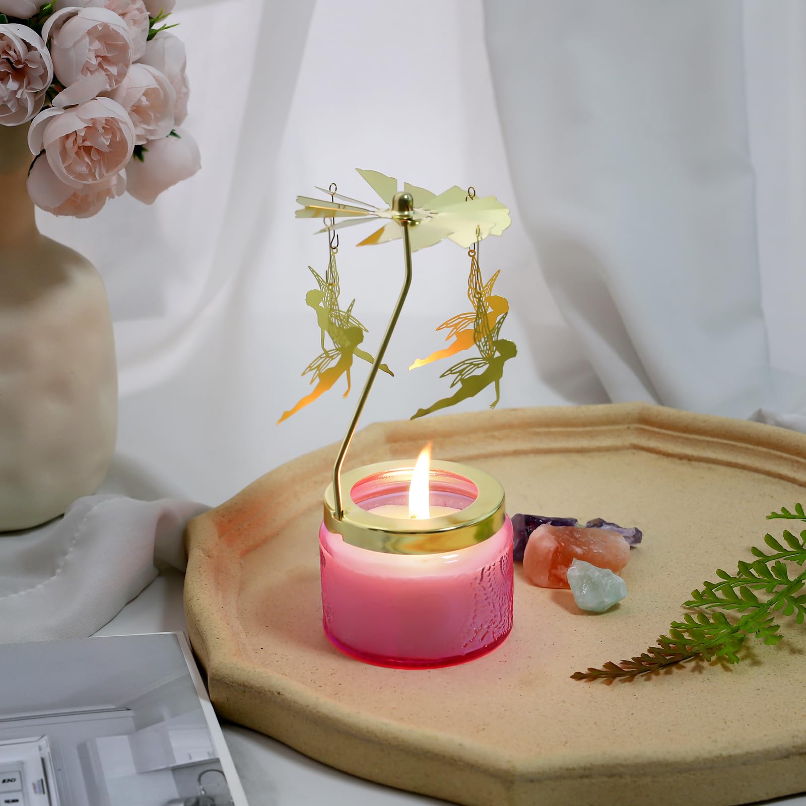 Close-up of rotating candle on decorative surface