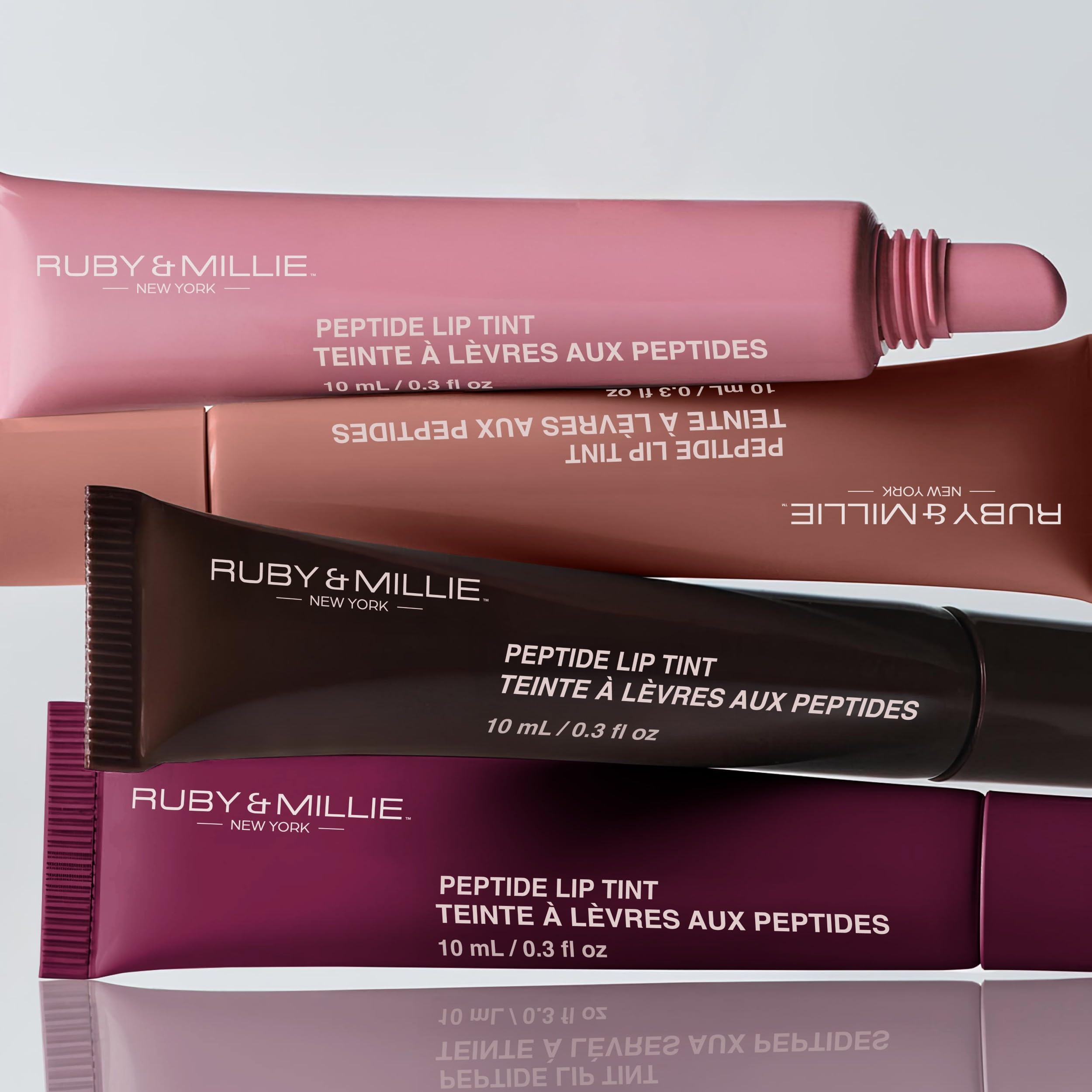 Ruby & Millie lightweight, non-sticky gloss texture visible on lips.