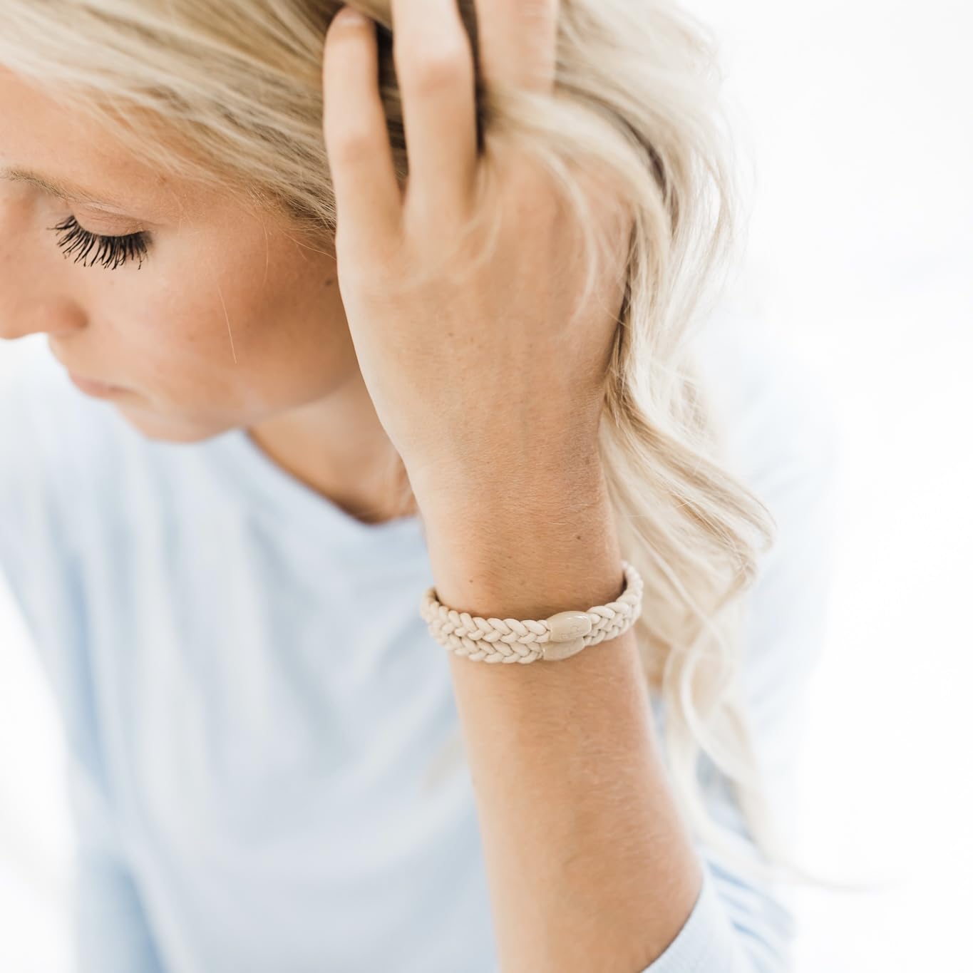 Neutral Cutie Bands used in hair for a secure hold with no damage.