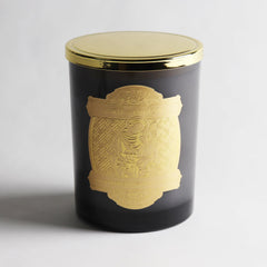 Prayer coin embedded inside the candle wax for blessings