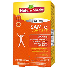 Bottle with a glass of water and SAM-e Complete tablet