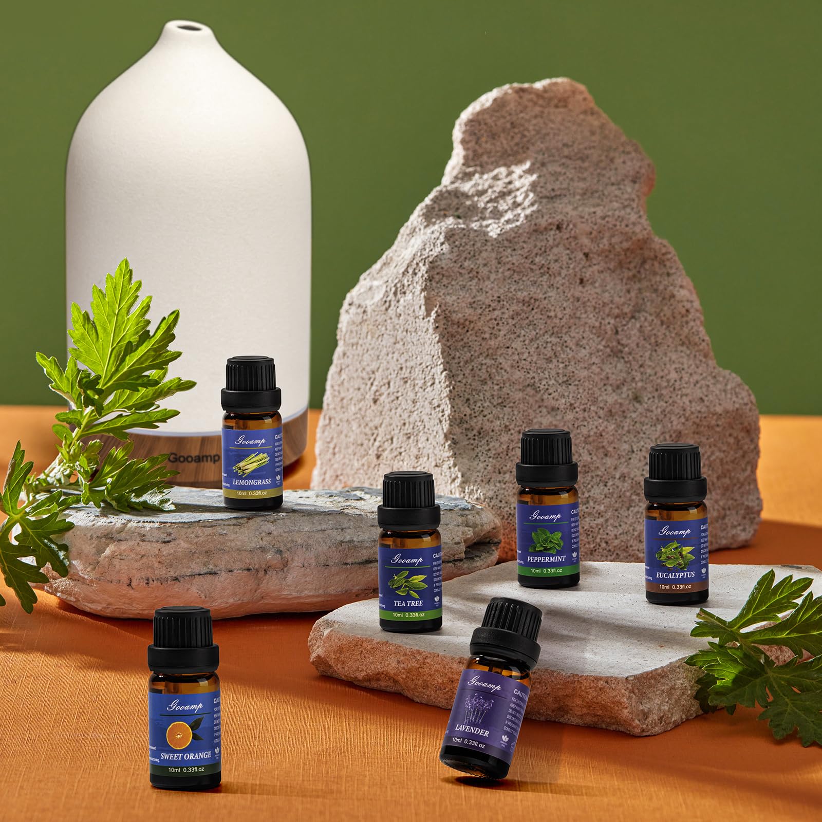 Sandalwood, Ylang Ylang, Chamomile and Cedarwood essential oil bottles included in the set