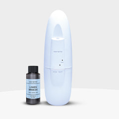 Scent Better Plug In Diffuser in black finish plugged into wall outlet