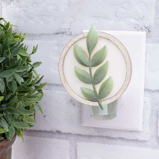 Close-up of Scent Charm diffuser with ambient light
