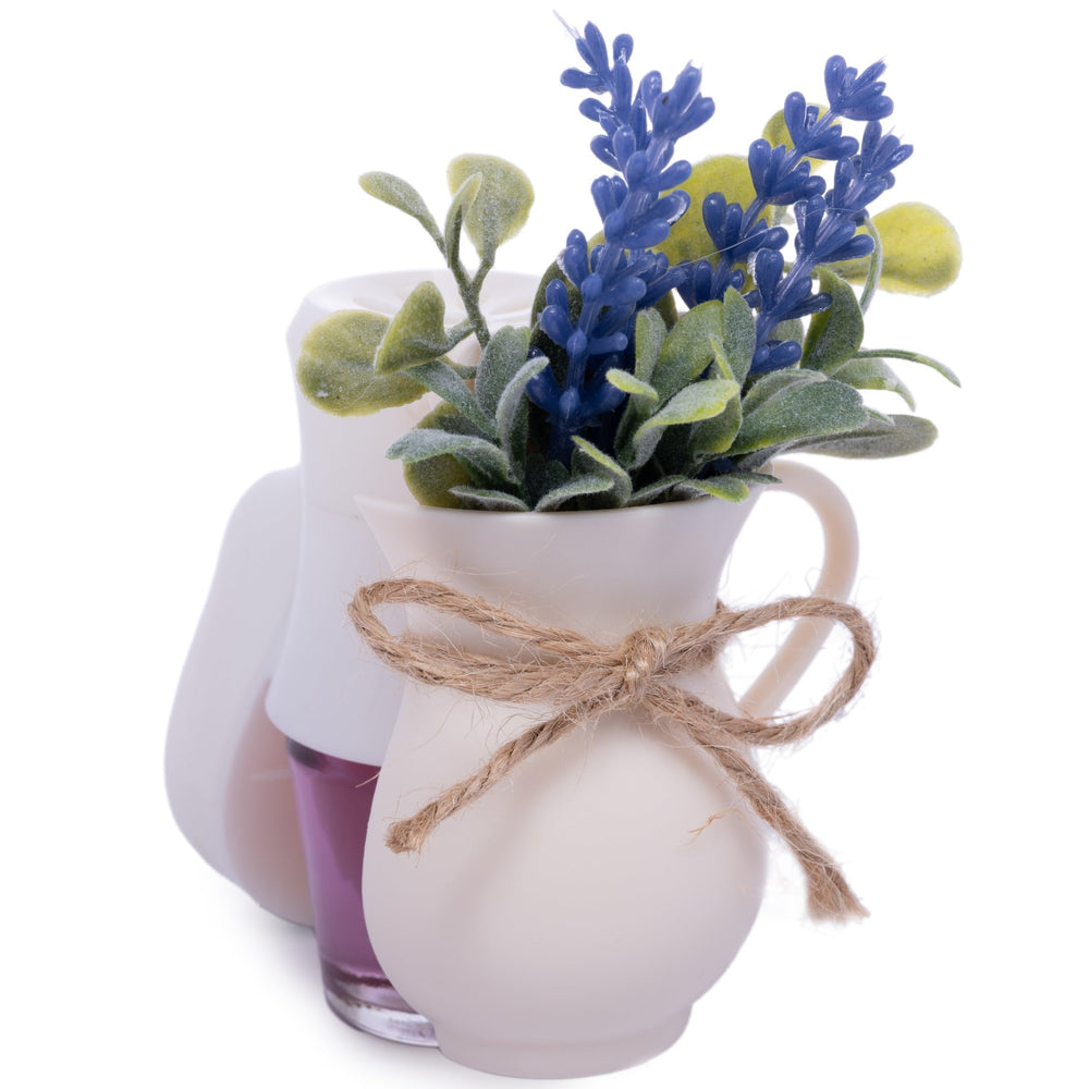 Close-up of Scent Charm diffuser plugged into wall outlet with lavender oil