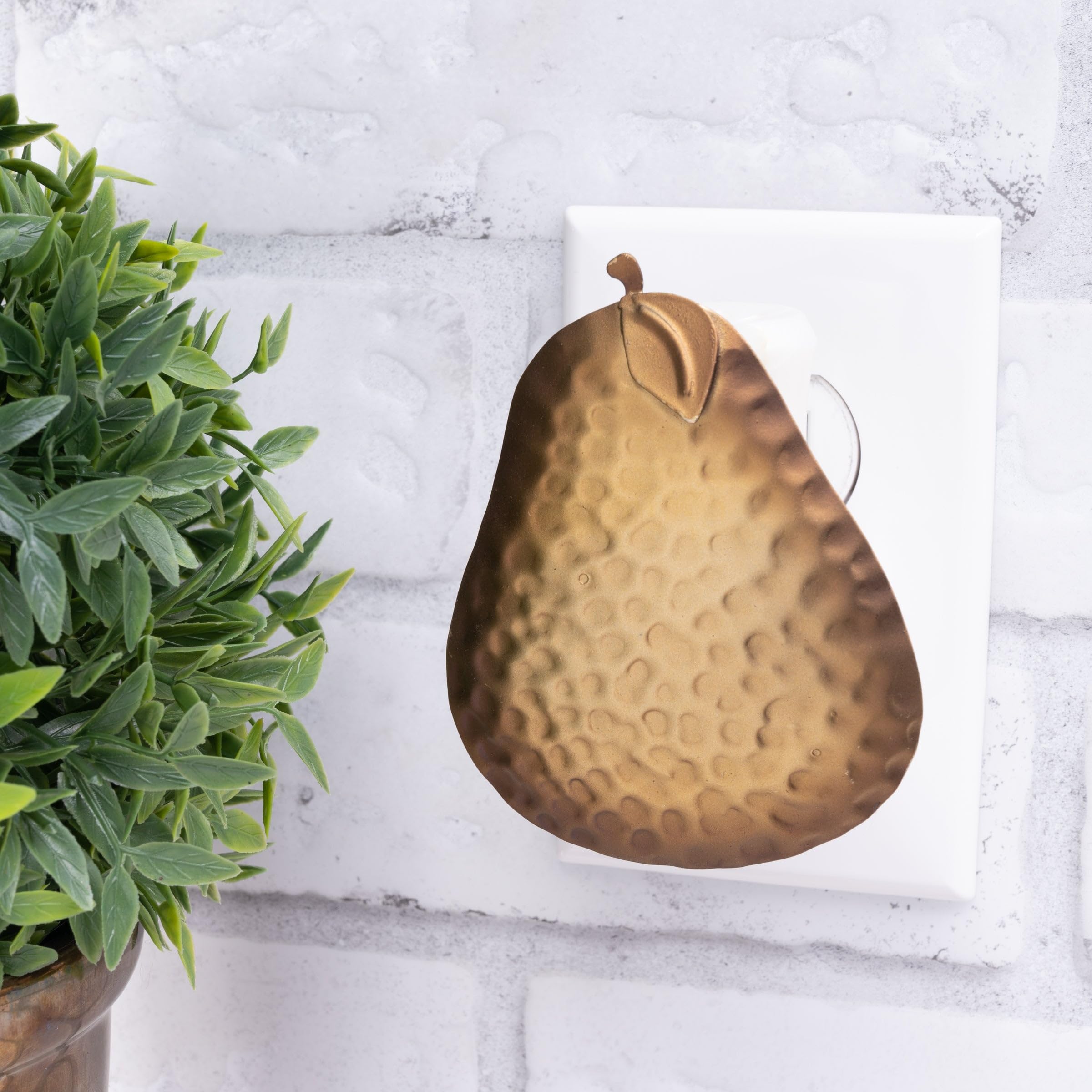 Scent Charm plug-in diffuser glowing in a bedroom