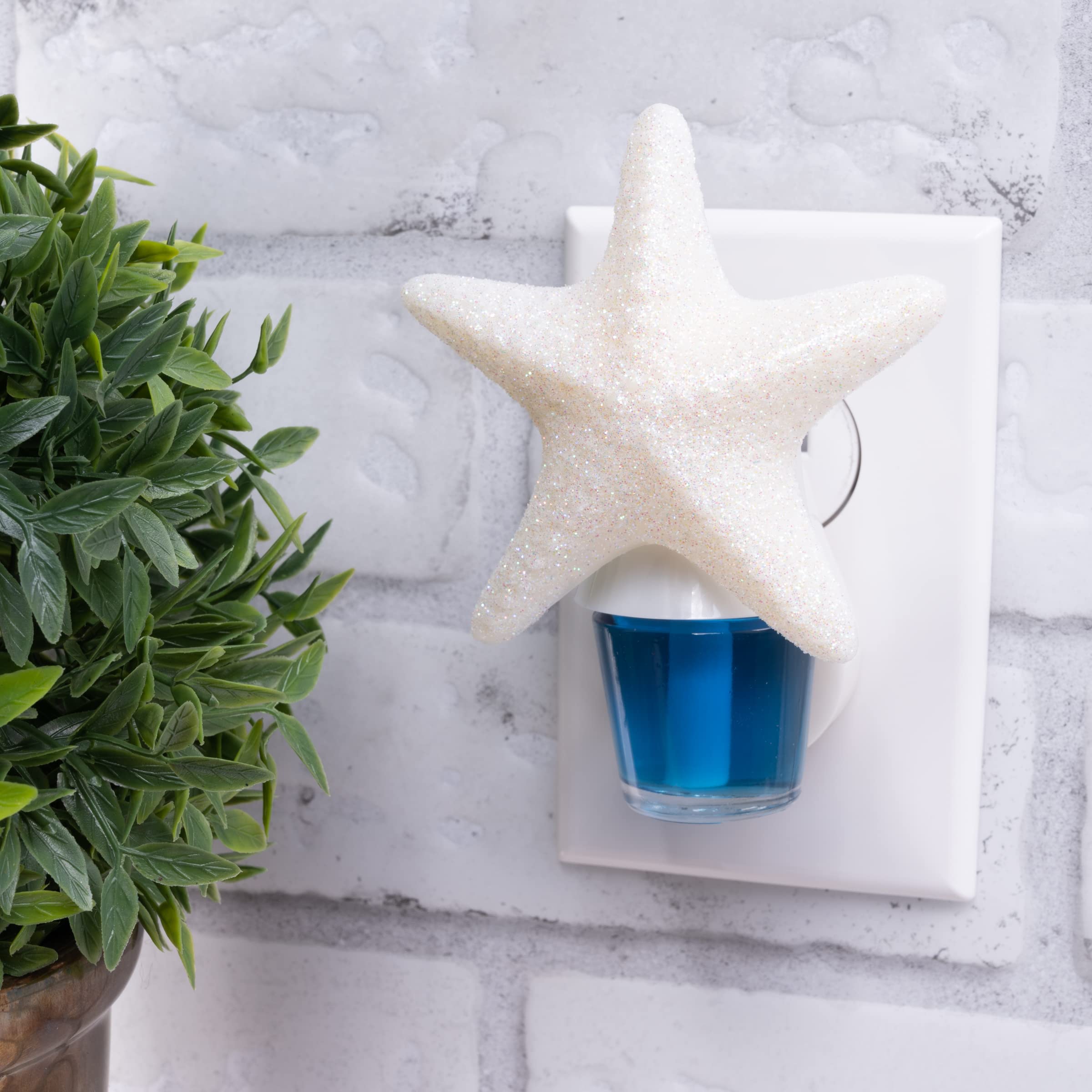 Close-up of ScentSationals Scent Charm diffuser with soft ambient light