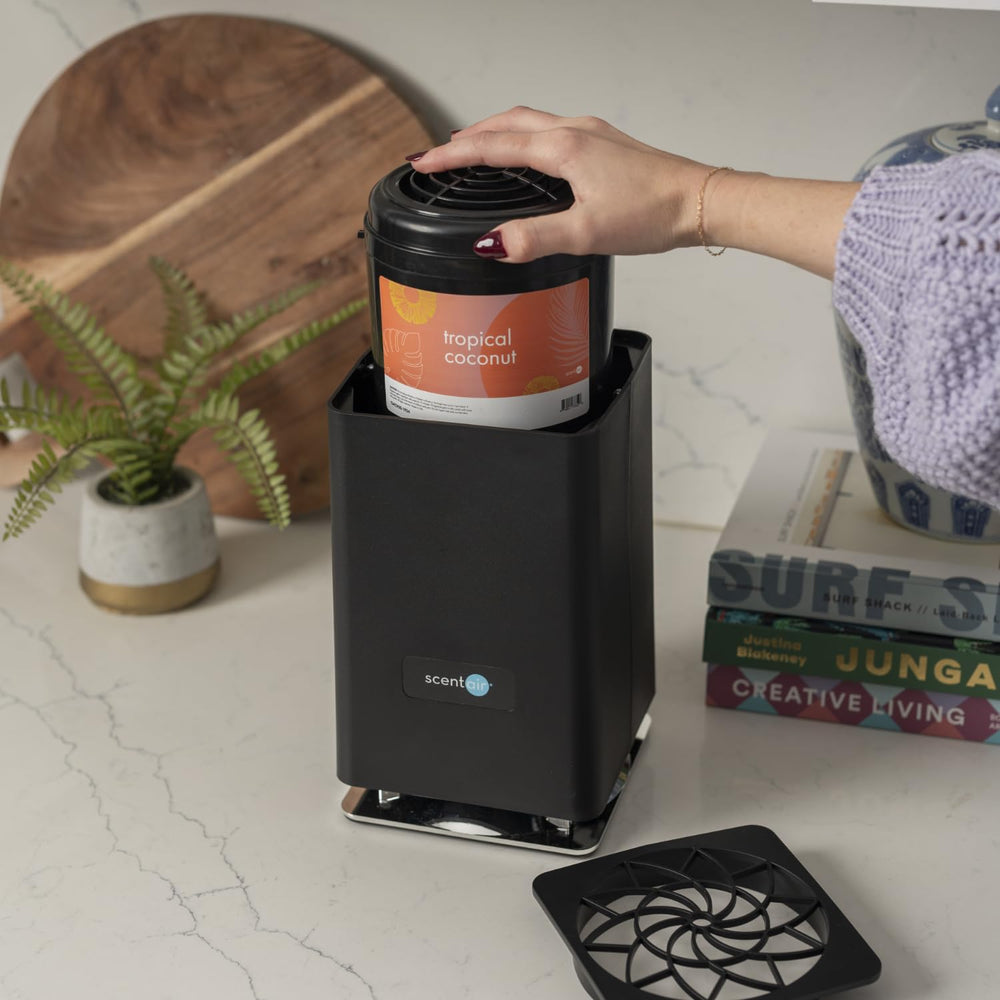 Compact ScentAir Whisper Home diffuser weighing 3.7 pounds
