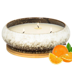Front view of 17 oz three-wick citrus scented candle in glass jar