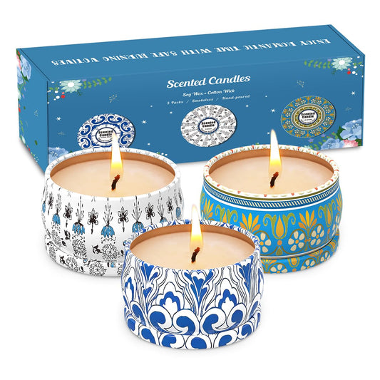 Three 2.5oz soy wax travel tin candles in Amber Musk, Lemon, and Lavender