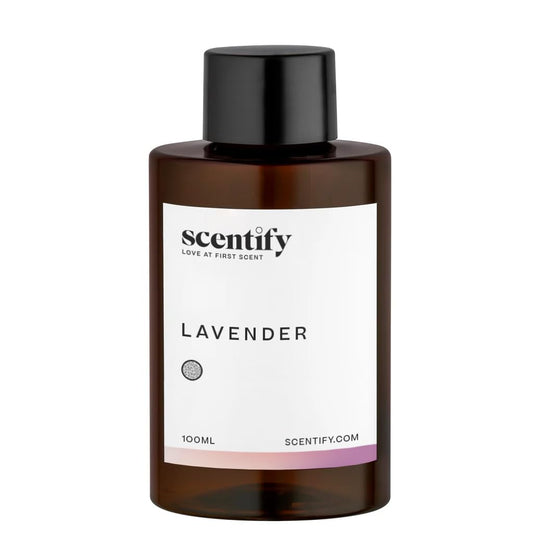 Close-up of amber diffuser oil bottle with lavender musk label
