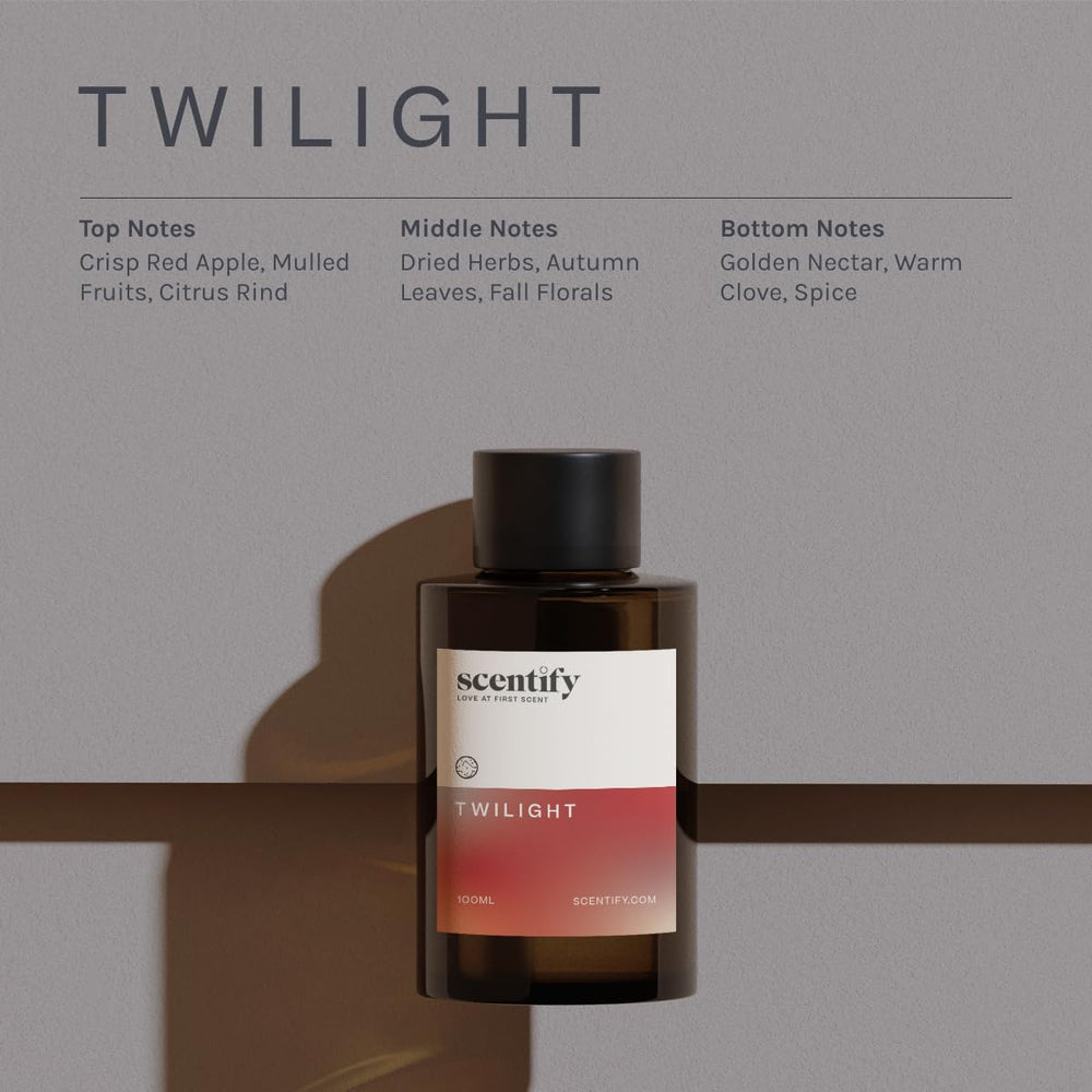 Scentify bottle beside active diffuser creating cozy festive room scent