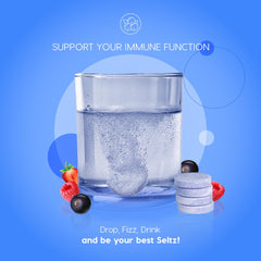 Tablet dissolving in a glass of water with fizz