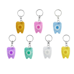SENLIN DENTAL tooth-shaped floss keychain – front view